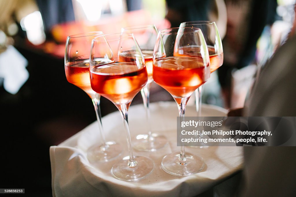 Rose wine drinks on tray