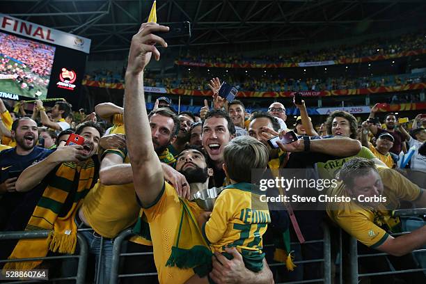 Australia's captain Mile Jedinak takes a selfie during the lap of honour after beating Korea Republic 2-1 at Stadium Australia. Sydney Australia....