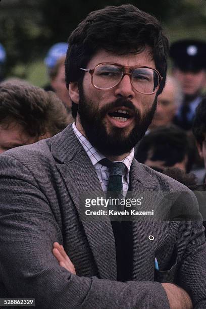 Sinn Fein leader Gerry Adams attends the funeral of an IRA volunteer, as officers of the Garda look on, Buncrana, County Donegal, Eire, 20th...