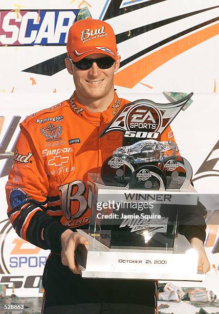 Dale Earnhardt Jr. Poses with the trophy in Victory Lane after winning Sunday's EA Sports 500 at Talladega Superspeedway in Talladega, Alabama....