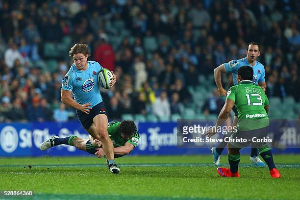 Michael Hooper of the Waratahs makes a break against the Highlander's during the semi-final match between the New South Wales Waratahs and the...