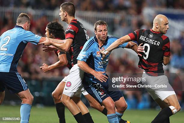 Sydney Derby - Sydney FC v Western Sydney Wanderers FC at Parramatta Stadium. Sydney's Lucas Neill and Wanderers Dino Kresinger push one another in...