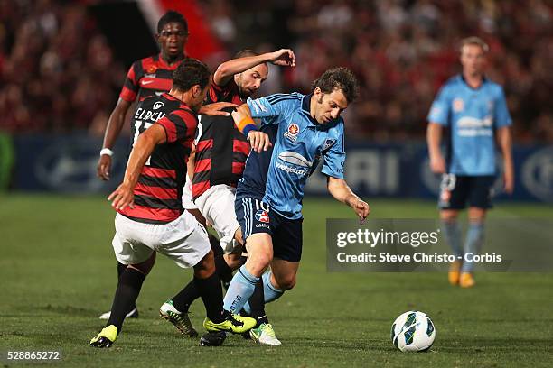 Sydney Derby - Sydney FC v Western Sydney Wanderers FC at Parramatta Stadium. Sydney's Alessandro Del Piero gets tackled by Wanderers Tarek Elrich...