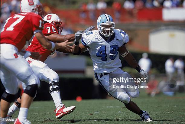 Julius Peppers of the University of North Carolina Tar Heels avoids getting tackled during the game against the North Carolina State University...