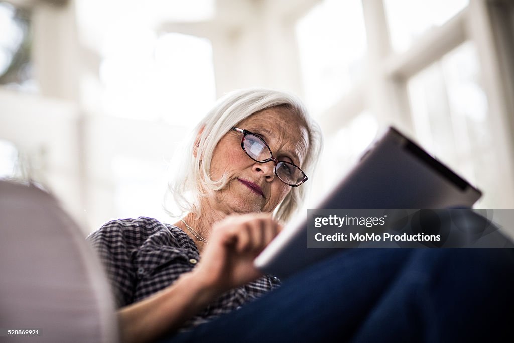 Senior woman using tablet