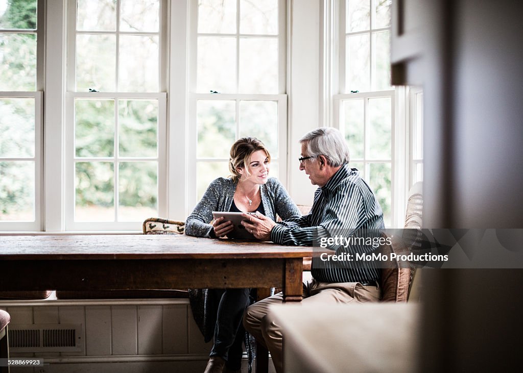 Father and daughter using tablet