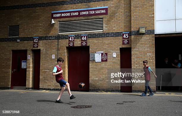 Young West Ham United supporters play outside the stadium prior to the Barclays Premier League match between West Ham United and Swansea City at the...