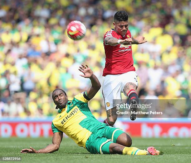 Marcos Rojo of Manchester United in action with Cameron Jerome of Norwich City during the Barclays Premier League match between Norwich City and...