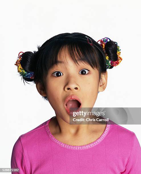 little girl expressing surprise - child shock studio stock-fotos und bilder