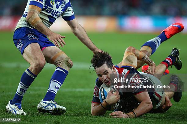 Aidan Guerra of the Roosters is tackled by the Bulldog's Tim Lafai during the Semi Final 1 match between the Sydney Roosters and the Canterbury...
