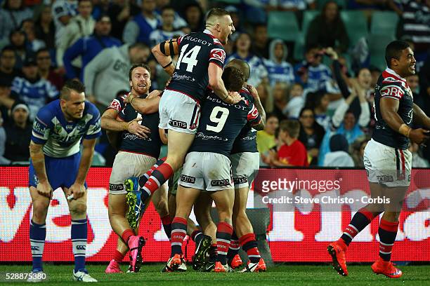 The Roosters celebrate Roger Tuivasa-Sheck's try during the Semi Final 1 match between the Sydney Roosters and the Canterbury Bankstown Bulldogs at...
