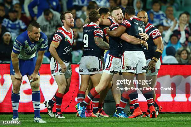 The Roosters celebrate Roger Tuivasa-Sheck's try during the Semi Final 1 match between the Sydney Roosters and the Canterbury Bankstown Bulldogs at...