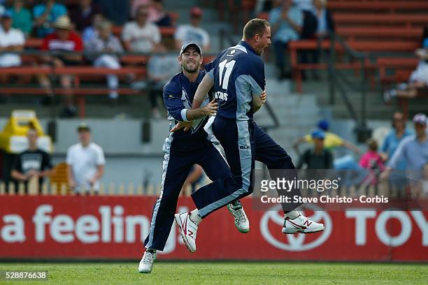 John Hastings of the Bushrangers celebrates the wicket of Blue's Sean Abbott with teammate Glenn Maxwell during the Matador BBQ's One-Day Cup between...
