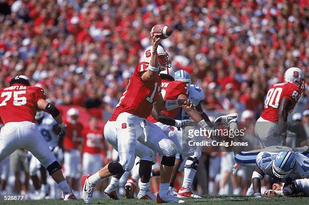 Philip Rivers of the North Carolina State University Wolfpack throws the ball during the game against the University of North Carolina Tar Heels at...