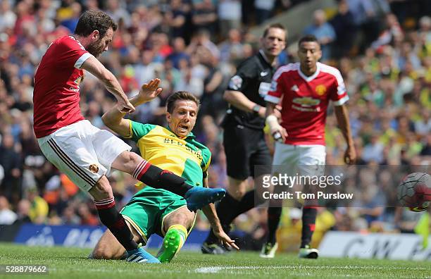 Juan Mata of Manchester United in action with Gary O'Neil of Norwich City during the Barclays Premier League match between Norwich City and...