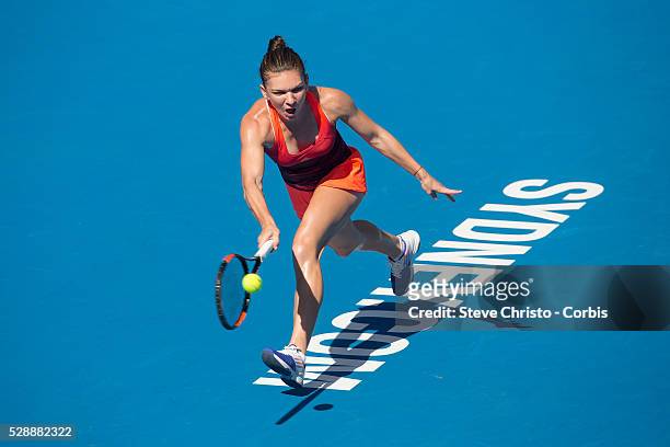 Simona Halep of Romania hits a forehand during her match against Czech Repubic's Karolina Pliskova on Ken Rosewall Arena at the Apia International...