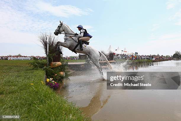 Olivia Wilmot of Great Britain riding Cool Dancer clears the lake fence during the cross-country test on day four of the Badminton Horse Trials on...