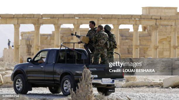 Members of the Syrian army patrol the ancient Syrian city of Palmyra on May 6 during a patriotic celebration put on by the Syrian regime at the...