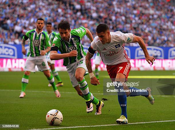 Ivo Ilicevic of Hamburg is challenged by Christian Tr��sch of Wolfsburg during the Bundesliga match between Hamburger SV and VfL Wolfsburg at the...