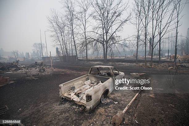 Home foundations and skeletons of possesions are all that remain in parts of a residential neighborhood destroyed by a wildfire on May 7, 2016 in...