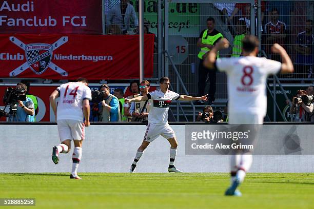 Robert Lewandowski of Bayern Muenchen celebrates scoring his team's second goal during the Bundesliga match between FC Ingolstadt and FC Bayern...