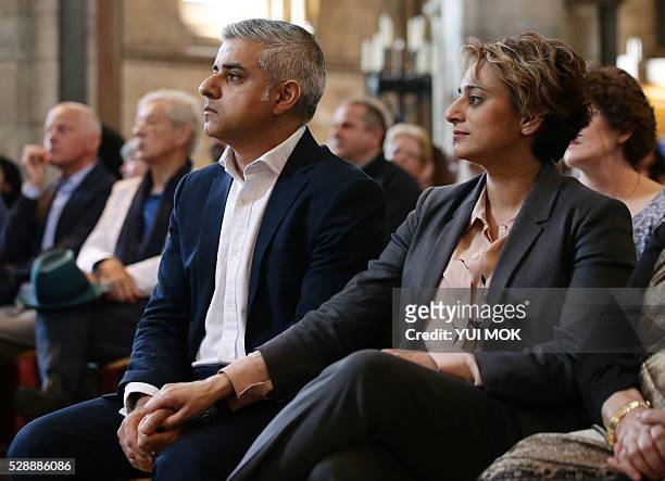 Britain's incoming London Mayor Sadiq Khan sits with his wife Saadiya, during his swearing-in ceremony at Southwark Cathedral in cental London on May...