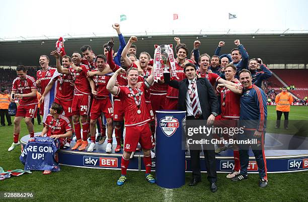 Middlesbrough players and staffs celebrate their promotion to the Premier League after the Sky Bet Championship match between Middlesbrough and...