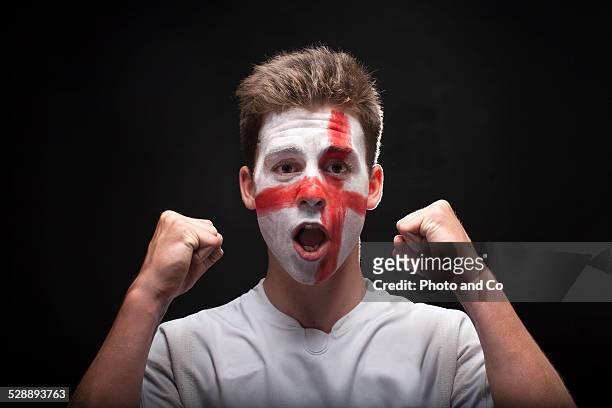 english fan with painted face - spain teen face bildbanksfoton och bilder