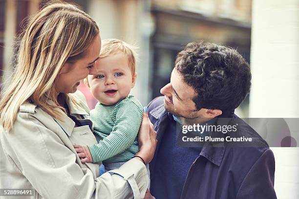 young couple with baby - boy happy blonde stock pictures, royalty-free photos & images