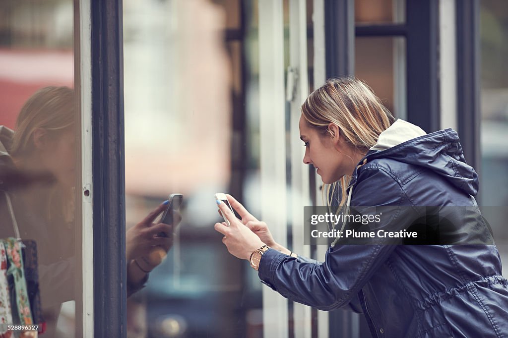 Woman taking a photo with smartphone