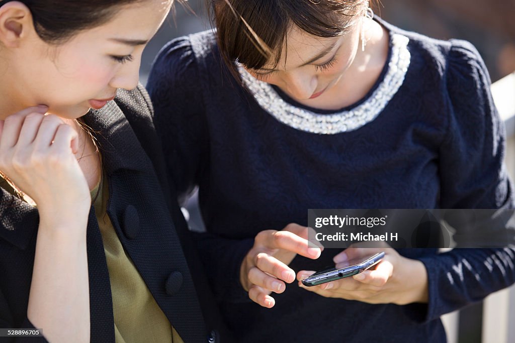 Young woman checking a smartphone