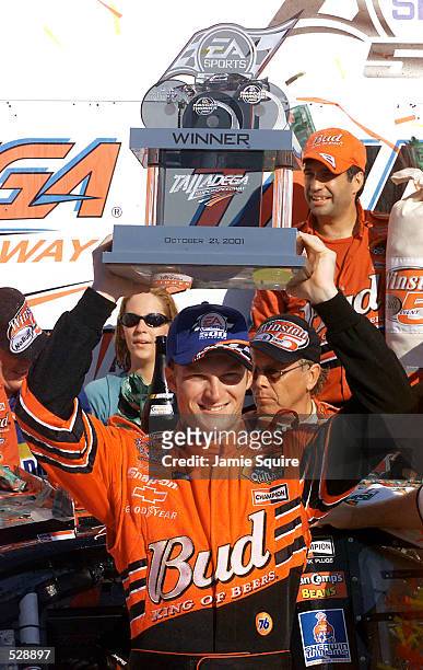 Dale Earnhardt Jr. Celebrates with the trophy in Victory Lane after winning Sunday's EA Sports 500 at Talladega Superspeedway in Talladega, Alabama....
