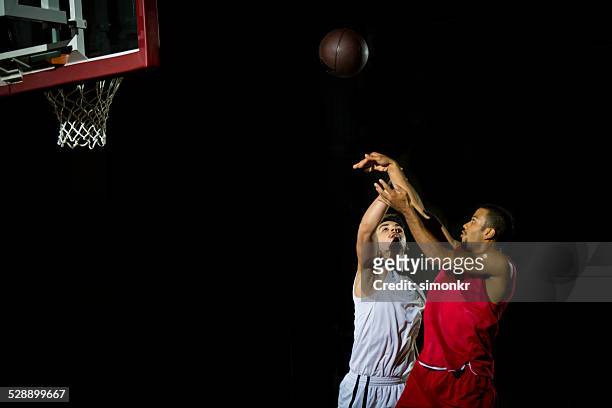 basketball player throwing a ball - jump shot stock pictures, royalty-free photos & images