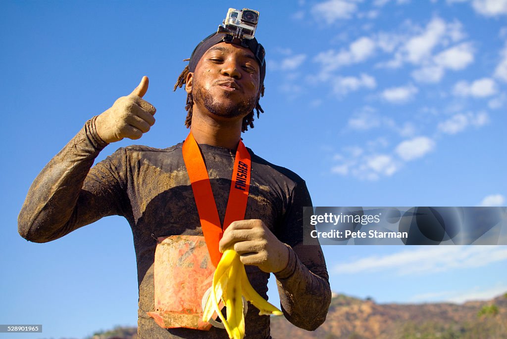 African American 5k competitor at finish of race.