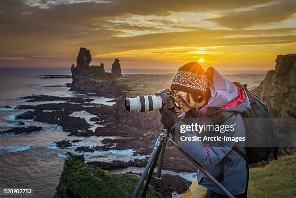 photographer taking pictures at sunset, iceland - photographer taking pictures nature stock pictures, royalty-free photos & images