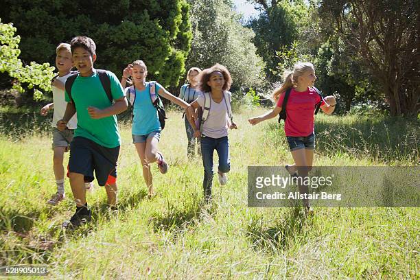 children on a school field trip in nature - 13 year old girls in shorts stock pictures, royalty-free photos & images