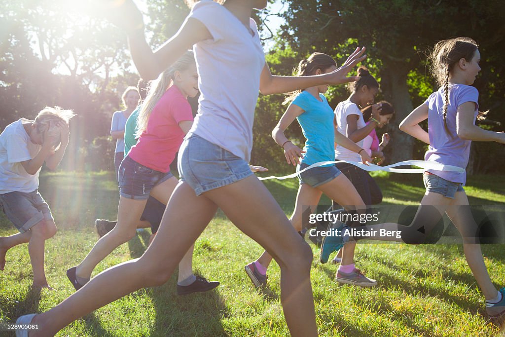 Group of children running together in a race