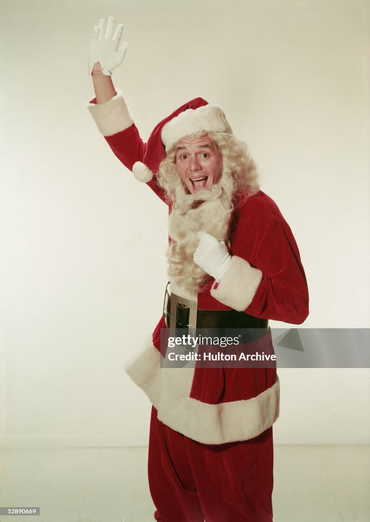 Desi Arnaz Pulls On Beard Of Santa Claus Costume