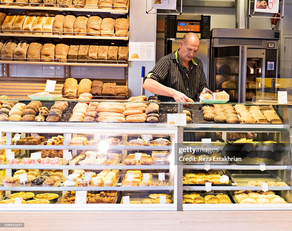 Bread seller places out cakes