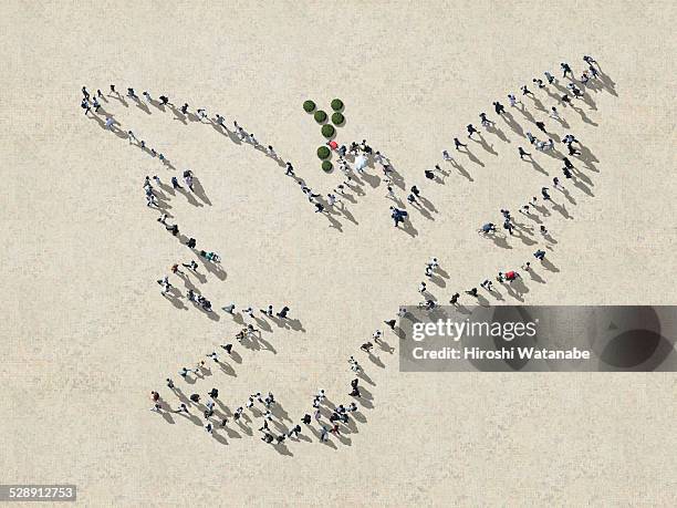 picasso's pigeon made out of walking people - symbols of peace stock pictures, royalty-free photos & images