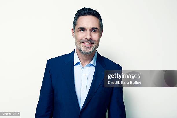 honest portrait of a business man. - blue suit portrait stock pictures, royalty-free photos & images
