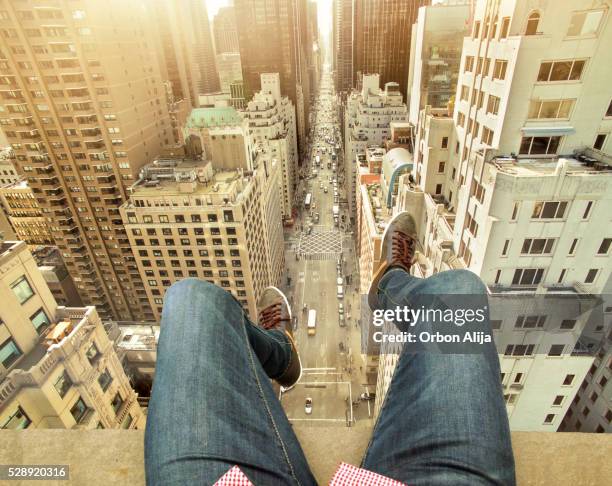 man on building terrace above new york city - shoes top view stock pictures, royalty-free photos & images