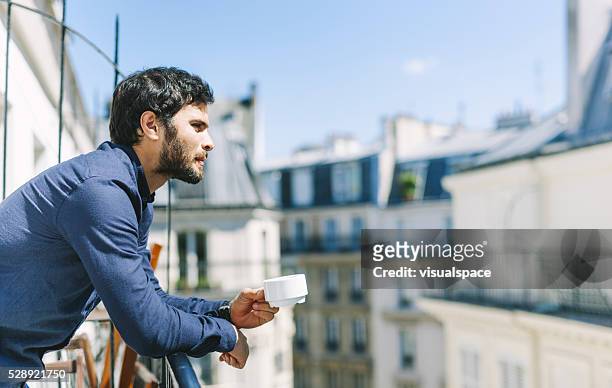 morning coffee in a sunny balcony - paris balcony stock pictures, royalty-free photos & images