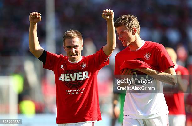 Philipp Lahm and Thomas Mueller of Bayern Muenchen celebrate the Bundesliga champions after beating Ingolstadt 2-1 in the Bundesliga match between FC...