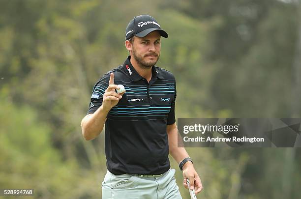 Chris Hanson of England waves to the crowd after his birdie on the 18th hole during the third round of the Trophee Hassan II at Royal Golf Dar Es...