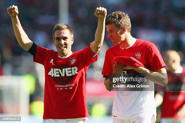 Philipp Lahm , Thomas Mueller and team mates of Muenchen celebrate being Bundesliga champions after beating Ingolstadt 2-1 in Rafinha and team mates...