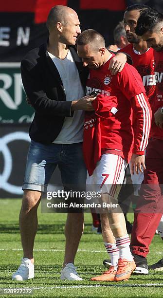 Arjen Robben and Franck Ribery of Bayern Muenchen celebrate their German Championship title after the Bundesliga match between FC Bayern Muenchen and...