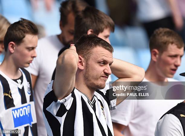 Newcastle United supporters react to the news that their rivals Sunderland have won, putting them in danger of relegation after the English Premier...