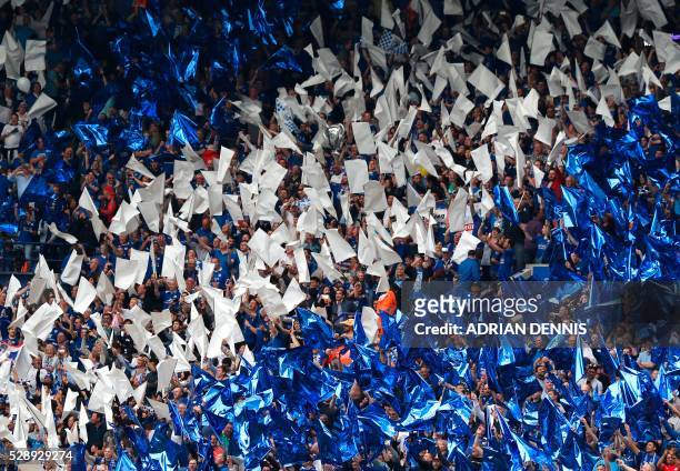 Leicester fans wave flags in the team colours before the English Premier League football match between Leicester City and Everton at King Power...