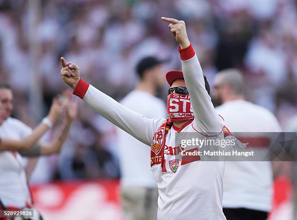 Fans of Stuttgart storm the field of play after the Bundesliga match between VfB Stuttgart and 1. FSV Mainz 05 at Mercedes-Benz Arena on May 7, 2016...